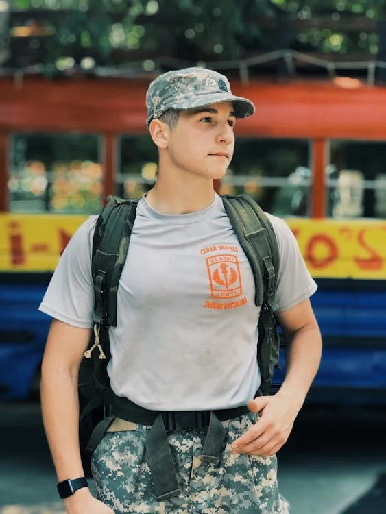 Man Wearing Military Uniform Carrying a Backpack // Healthier Veterans Today