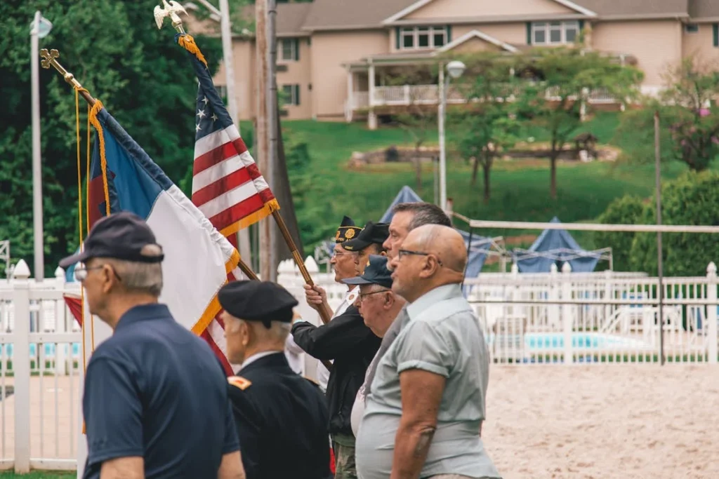 Men Standing Near Flags // Healthier Veterans Today