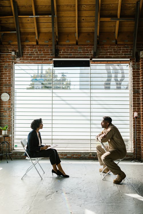 Photo of Man and Woman Sitting Beside Window // Healthier Veterans Today