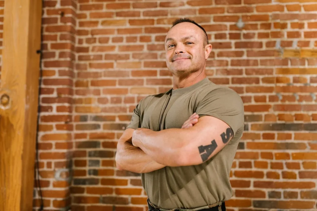 Photo of Soldier Standing in front of Brick Wall // Healthier Veterans Today