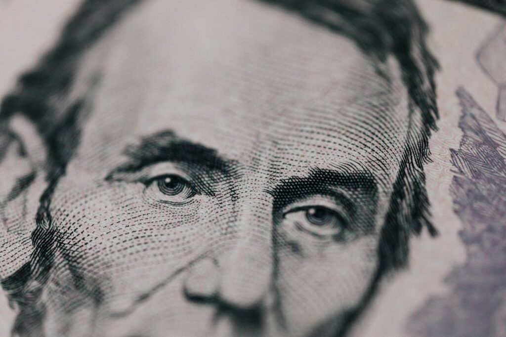 Closeup of president printed on bill looking away // Healthier Veterans Today