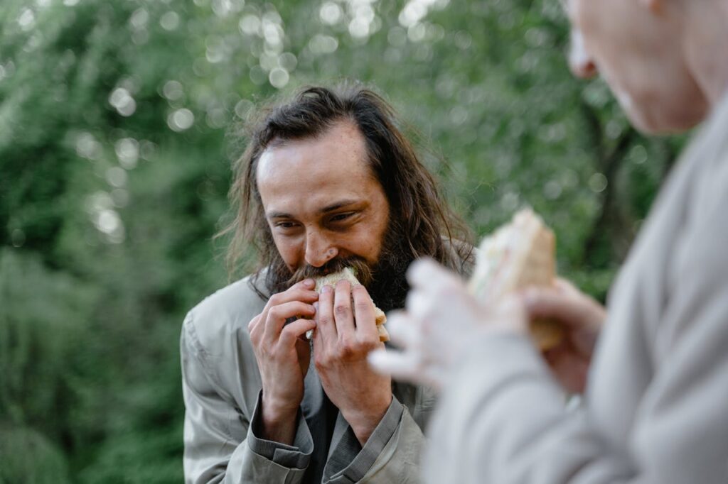 Homeless Guy eating Sandwich // Healthier Veterans Today
