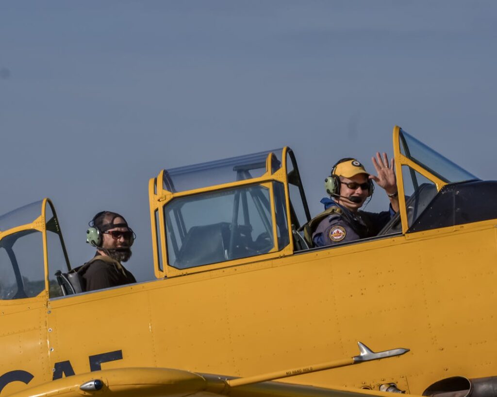 Pilot and a Passenger in the Cockpit of a World War II Fighter // Healthier Veterans Today