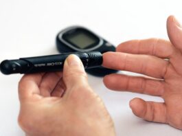 Diabetes Shoes, Person Holding Black Tube // Healthier Veterans Today