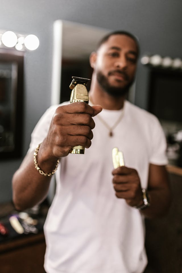 A Barber Holding Clippers // Healthier Veterans Today