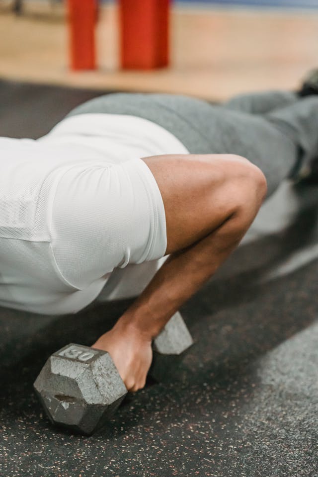 Ethnic male doing exercise with dumbbells // Healthier Veterans Today