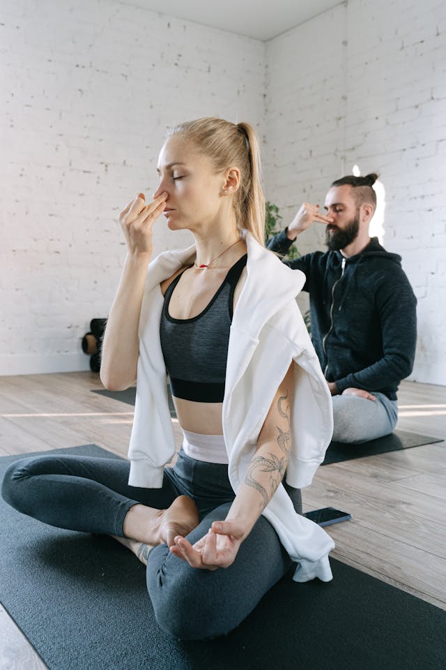 Man and woman doing breathing exercises // Healthier Veterans Today