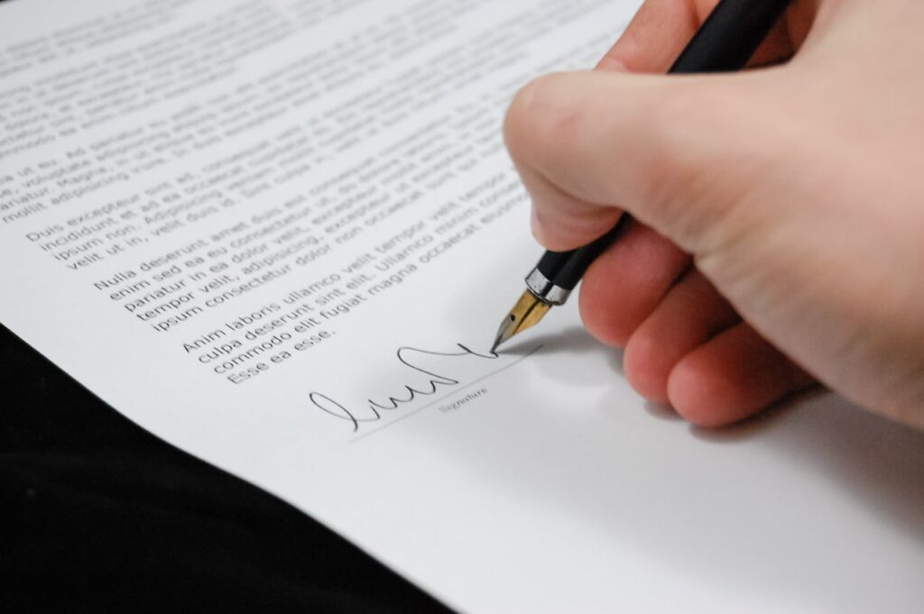 Person Signing in Documentation Paper // Healthier Veterans Today