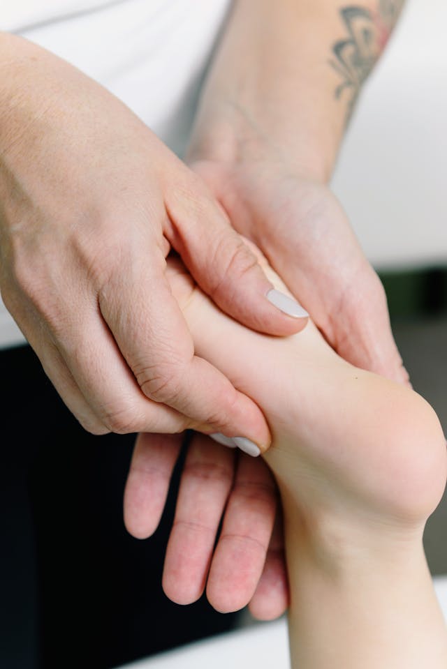 Physiotherapist Massaging a Foot // Healthier Veterans Today