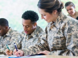 Military service members in uniform completing paperwork and preparing for military service // Healthier Veterans Today